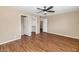 Spacious main bedroom with wood flooring, a ceiling fan, and walk-in closet at 7331 W Aster Dr, Peoria, AZ 85381
