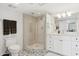 Bathroom with a walk-in shower and white vanity at 7359 E Valley View Rd, Scottsdale, AZ 85250