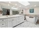 Spa-like bathroom with a large soaking tub and double vanity at 7359 E Valley View Rd, Scottsdale, AZ 85250