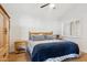 Guest bedroom with a queen-size bed and wood furniture at 7359 E Valley View Rd, Scottsdale, AZ 85250