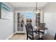 Cozy dining area with wood table and chairs, and access to backyard patio at 7359 E Valley View Rd, Scottsdale, AZ 85250