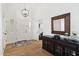 Bright and airy entryway with hardwood floors and stylish console table at 7359 E Valley View Rd, Scottsdale, AZ 85250