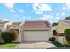 Attractive front exterior of home with a two-car garage and landscaping at 7359 E Valley View Rd, Scottsdale, AZ 85250
