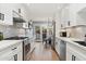 Updated kitchen with white cabinets, stainless steel appliances and eat-in area at 7359 E Valley View Rd, Scottsdale, AZ 85250