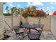 Private patio with wrought iron furniture and blooming vines at 7359 E Valley View Rd, Scottsdale, AZ 85250
