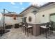 Outdoor patio with seating area, fire pit, and bar at 7359 E Valley View Rd, Scottsdale, AZ 85250