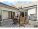 Outdoor dining area with seating for six and a grill at 7359 E Valley View Rd, Scottsdale, AZ 85250