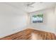 Bright bedroom with wood floors and mirrored closet at 7725 E Portland St, Scottsdale, AZ 85257