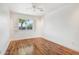 Bright bedroom with hardwood floors and a ceiling fan at 7725 E Portland St, Scottsdale, AZ 85257