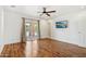 Bedroom with wood floors, sliding door to patio, and pool view at 7725 E Portland St, Scottsdale, AZ 85257