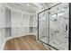 Walk-in closet and glass enclosed shower with marble accents at 7860 E Davenport Dr, Scottsdale, AZ 85260