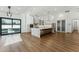 Spacious kitchen featuring a central island, stainless steel appliances, and access to outdoor living at 7860 E Davenport Dr, Scottsdale, AZ 85260
