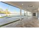Spacious covered patio overlooking a pool and well-maintained artificial grass lawn at 7860 E Davenport Dr, Scottsdale, AZ 85260