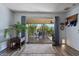 Living room with sliding glass doors opening to a patio at 9319 W Glen Oaks Cir, Sun City, AZ 85351