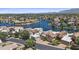 Luxury community featuring stunning waterfront homes, lush landscaping, and serene water views at 10120 E Topaz Dr, Scottsdale, AZ 85258