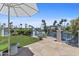 Well manicured back yard with a patio and view of the canal at 10120 E Topaz Dr, Scottsdale, AZ 85258
