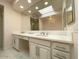 Elegant bathroom with double vanity, marble counters, and a large soaking tub at 10120 E Topaz Dr, Scottsdale, AZ 85258