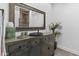 Bathroom vanity featuring an antique-style cabinet, vessel sink, decorative mirror, and ornate decor at 10120 E Topaz Dr, Scottsdale, AZ 85258