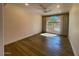 Bright bedroom with hardwood floors and large window at 10120 E Topaz Dr, Scottsdale, AZ 85258