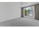 Empty bedroom with gray carpet, large windows, and plenty of natural light at 10120 E Topaz Dr, Scottsdale, AZ 85258