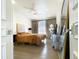 Well-lit bedroom showcasing hardwood floors, neutral tones, and modern decor at 10120 E Topaz Dr, Scottsdale, AZ 85258