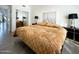 Bedroom with hardwood floors, neutral colors, modern decor, and large bed at 10120 E Topaz Dr, Scottsdale, AZ 85258