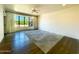 Spacious bedroom with hardwood floors and large windows at 10120 E Topaz Dr, Scottsdale, AZ 85258