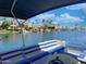 View from the boat, showing calm water, palm trees, and waterfront homes at 10120 E Topaz Dr, Scottsdale, AZ 85258