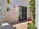Quaint courtyard features a small table and chairs, providing a private outdoor retreat at 10120 E Topaz Dr, Scottsdale, AZ 85258
