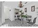 Bright dining area with a view of the laundry and white walls at 10120 E Topaz Dr, Scottsdale, AZ 85258