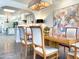 Open-concept dining room featuring a chandelier, a hardwood table, and view of kitchen at 10120 E Topaz Dr, Scottsdale, AZ 85258