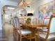 Formal dining room boasts a stylish light fixture and seamless flow to the kitchen area, perfect for entertaining at 10120 E Topaz Dr, Scottsdale, AZ 85258