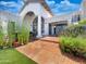 Inviting covered patio with stone floors, ample seating, and lush landscaping, perfect for relaxing at 10120 E Topaz Dr, Scottsdale, AZ 85258