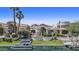 Luxurious waterfront home boasting a private boat dock, lush green lawn, and a beautiful sunset at 10120 E Topaz Dr, Scottsdale, AZ 85258