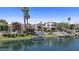 Stunning waterfront home boasting a private dock, multiple outdoor living spaces, and picturesque views at 10120 E Topaz Dr, Scottsdale, AZ 85258