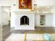 Elegant fireplace with white marble surround and stylish built-in shelving at 10120 E Topaz Dr, Scottsdale, AZ 85258