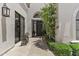 Charming front entrance of a stucco home with landscaped garden at 10120 E Topaz Dr, Scottsdale, AZ 85258