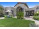 Beautiful front exterior of the property with manicured lawn and a stucco exterior at 10120 E Topaz Dr, Scottsdale, AZ 85258