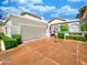 Well-maintained white garage exterior with tidy landscaping and ample driveway space at 10120 E Topaz Dr, Scottsdale, AZ 85258