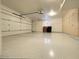 Two-car garage with epoxy flooring and ample storage cabinets at 10120 E Topaz Dr, Scottsdale, AZ 85258