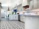 This kitchen features patterned tile floors, stainless steel appliances, and a large center island at 10120 E Topaz Dr, Scottsdale, AZ 85258