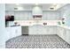 Modern kitchen with white cabinets, granite countertops, and stainless steel appliances at 10120 E Topaz Dr, Scottsdale, AZ 85258