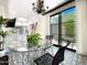 Eat-in kitchen area featuring chandelier lighting, patterned tile floors and backyard views at 10120 E Topaz Dr, Scottsdale, AZ 85258