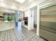 Open concept kitchen featuring patterned tile floors, stainless steel appliances, and white cabinetry at 10120 E Topaz Dr, Scottsdale, AZ 85258
