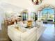 Bright and airy living room with large windows and comfortable, stylish seating at 10120 E Topaz Dr, Scottsdale, AZ 85258