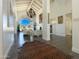 Spacious living room with vaulted ceilings, a chandelier, and a large arched window at 10120 E Topaz Dr, Scottsdale, AZ 85258