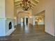 Open living room with hardwood floors, fireplace and high ceilings at 10120 E Topaz Dr, Scottsdale, AZ 85258