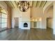 Elegant living room with hardwood floors, high ceilings, and a fireplace at 10120 E Topaz Dr, Scottsdale, AZ 85258