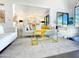 Open-concept living room with white sofas, a decorative coffee table, and seamless flow to the dining area at 10120 E Topaz Dr, Scottsdale, AZ 85258