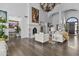 Bright and airy living room featuring a fireplace, wood floors, and modern decor at 10120 E Topaz Dr, Scottsdale, AZ 85258
